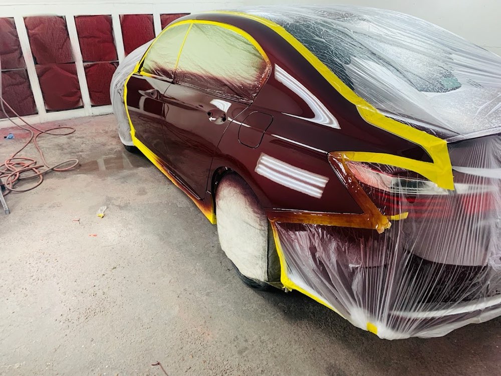 JJ's Paint and Body Works - shop exterior and team at work